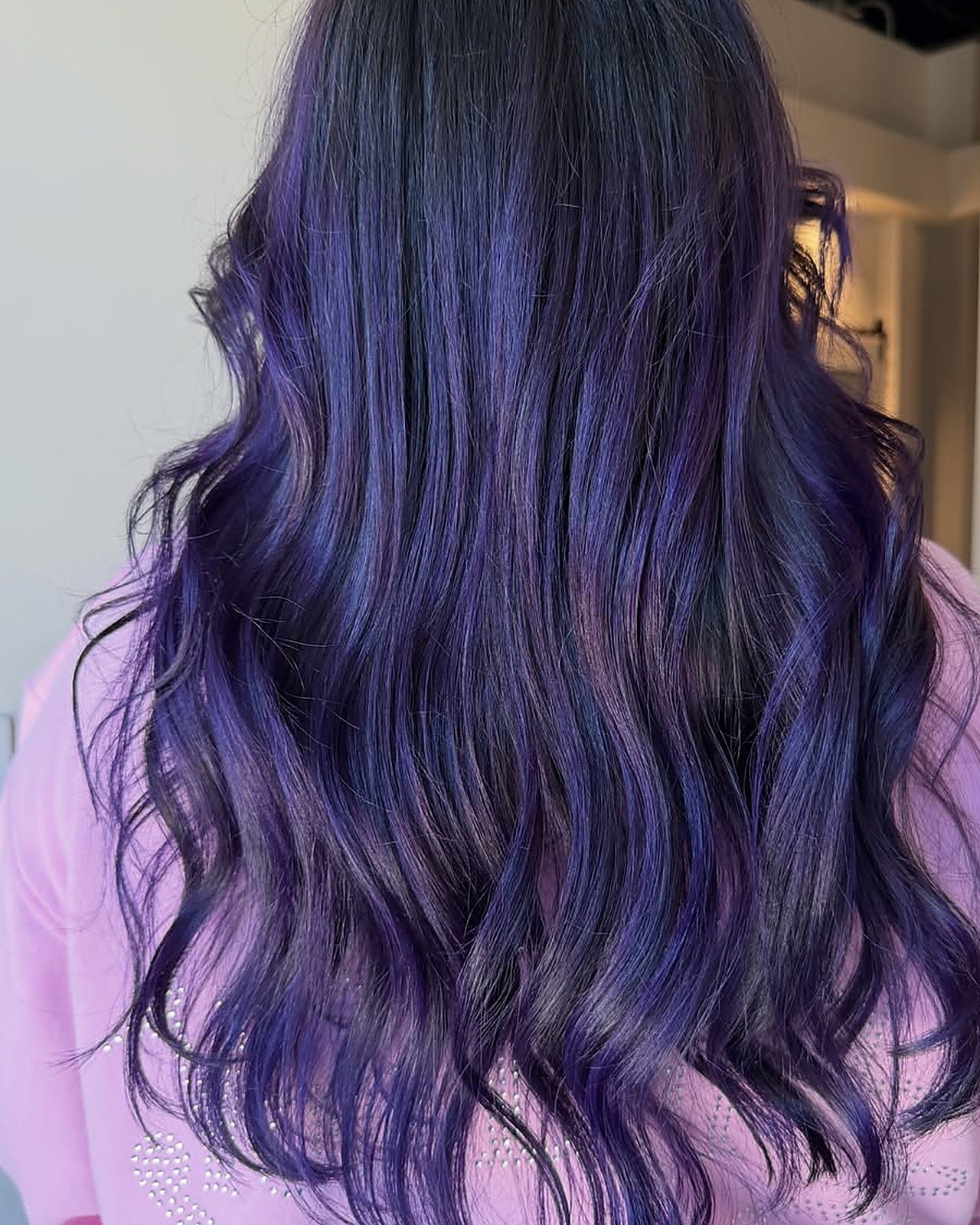 Dimensional violet — violet and indigo worked through the mid-lengths, roots kept dark