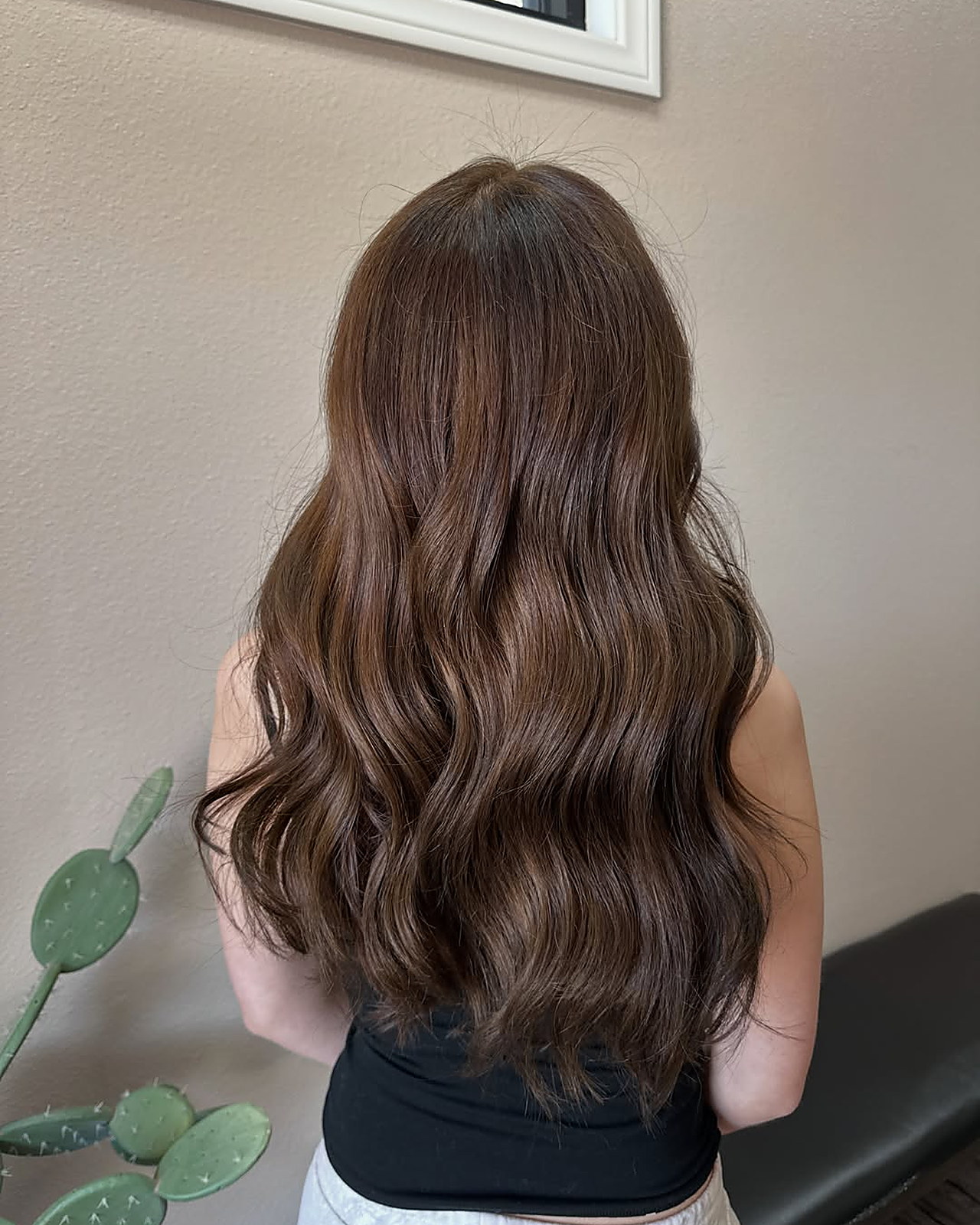 Warm brunette — blended lightening from root through the wave